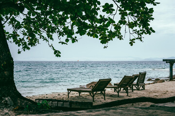 Fototapeta na wymiar Nature in twilight period which including of sunrise over the sea and the nice beach. Summer beach with blue water and purple sky at the sunset. 