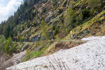Hiking in Val D'Ayas, Valle D'Aosta Italy. In early june a snowslide covered entirely the hiking path