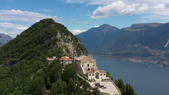 Aerial panorama of the Eremo di Montecastello church on Lake Garda. Aerial panorama of Eremo di Montecastello in Italy aerial view. Catholic church on a mountain surrounded by the Alps.
