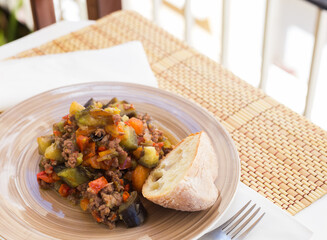 dish of vegetable stew. stewed eggplant, minced meat, carrots, peppers, onion squid