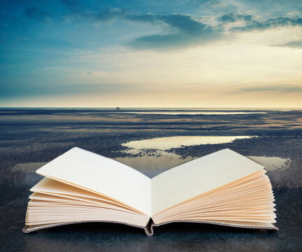 Conceptual landscape image of two people on remote beach with Instagram style filter coming out of pages in imaginary book