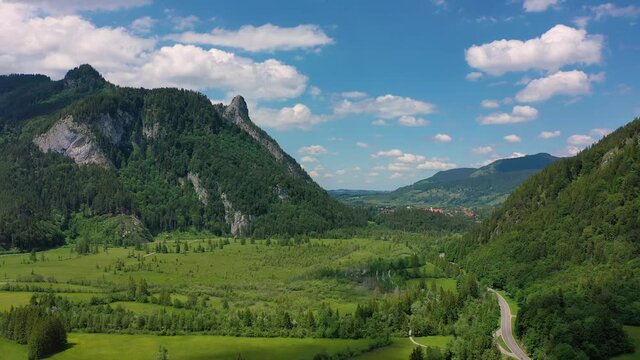 Mountain view in Oberammargau. Green meadow at the foot of the mountains.