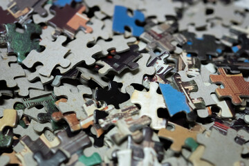 jigsaw puzzle on wooden background. to represent how complexity in game and challenge. plan and goal as concept.