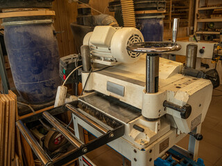Carpentry workshop. Close-up of an electric planer machine.
