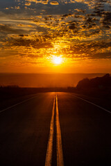 Obraz na płótnie Canvas Sunset in the road