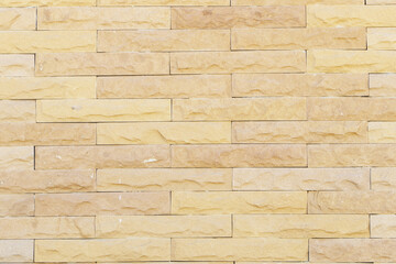 light yellow grunge brick wall texture background for stone tile block painted in yellow light color wallpaper modern interior exterior room backdrop design can be used as model building, house wall