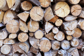 Fototapeta premium Firewood chopped and stacked, firewood background