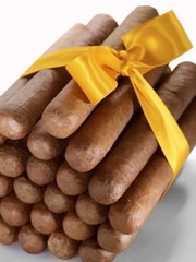 Close up view of bunch of cigars on white back