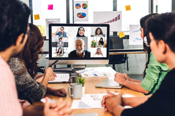 Group of professional asian business meeting and discussing strategy with new startup project.Creative business people video conference online meeting with business colleagues team in modern office