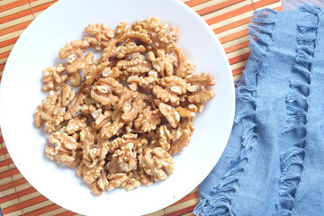 walnut on a plate on table , close up.