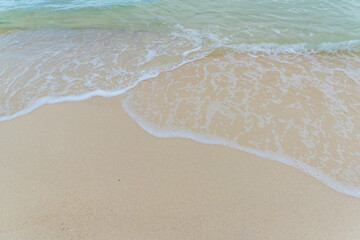Nature in twilight period which including of sunrise over the sea and the nice beach. Summer beach with blue water and purple sky at the sunset.	
