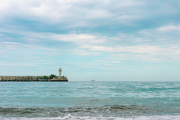 minimalistic seascape. lighthouse on the sea