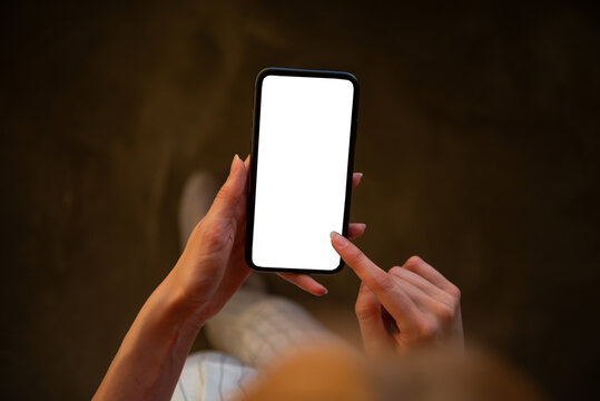 woman using mobile phone with blank white screen