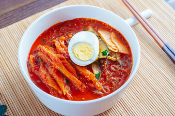 spicy buckwheat noodles with marinated dried pollack, Korean food 'kodari naengmyeon'