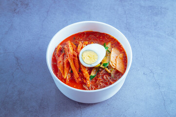spicy buckwheat noodles with marinated dried pollack, Korean food 'kodari naengmyeon'