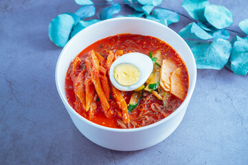 spicy buckwheat noodles with marinated dried pollack, Korean food 'kodari naengmyeon'