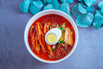spicy buckwheat noodles with marinated dried pollack, Korean food 'kodari naengmyeon'