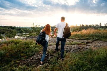 Fototapeta na wymiar Home Country Traveling, domestic travel, Country Escapes, Neutral color couple portrait. Local travel, Solo Explorers, Small Group tourist. Young couple going for hiking, walk in nature
