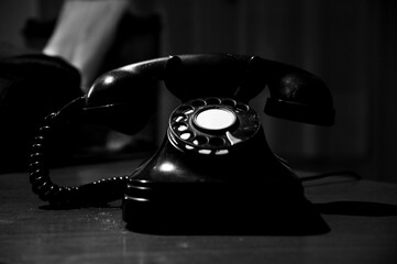 One old black phone on the table