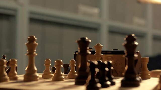 The game of chess on a wooden chessboard. Close-up 
