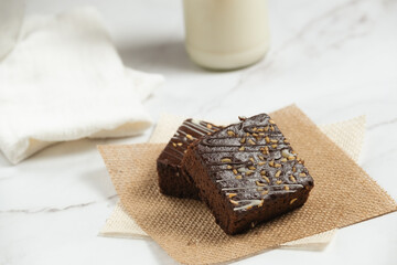 chocolate brownies on dark and white background homemade bakery and dessert white marble top view flat lay looking down with text space copy space