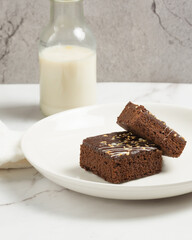 chocolate brownies on dark and white background homemade bakery and dessert white marble top view flat lay looking down with text space copy space
