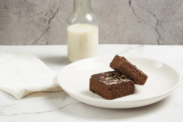 chocolate brownies on dark and white background homemade bakery and dessert white marble top view flat lay looking down with text space copy space
