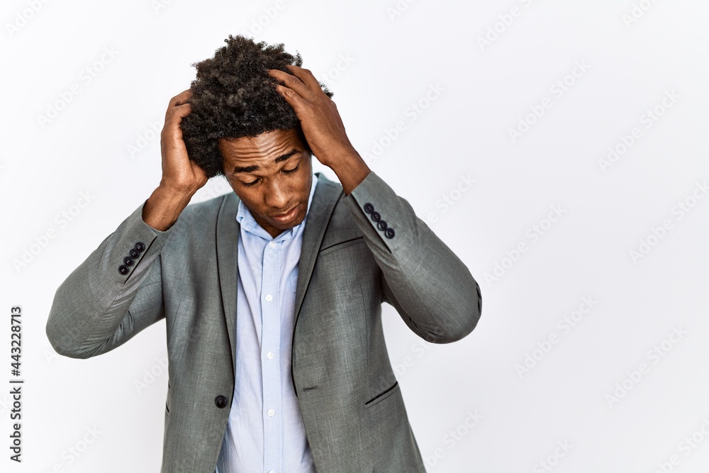 Sticker Young african american man wearing business jacket over isolated white background suffering from headache desperate and stressed because pain and migraine. hands on head.