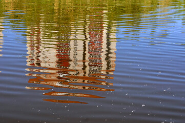 Reflection of a high-rise building in the river