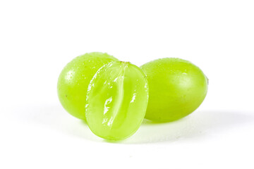 fresh ripe cut green grape isolated on white background.