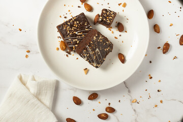 chocolate brownies on dark and white background homemade bakery and dessert white marble top view...