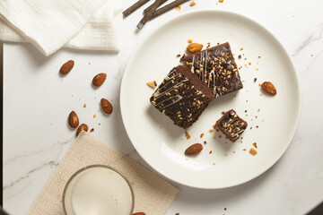 chocolate brownies on dark and white background homemade bakery and dessert white marble top view...