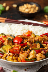 Kung Pao Chicken with Peppers, zucchini and rice. Asian take away food
