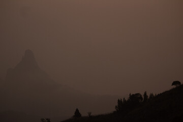 Fototapeta na wymiar View of rangaswamy peek in kodanadu in the early morning and clouds passing top of the peek