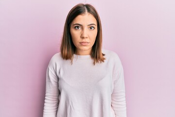 Obraz premium Young beautiful woman wearing casual clothes with serious expression on face. simple and natural looking at the camera.