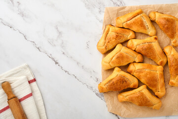 Fried empanadas with cilantro, meat, egg, tomato and chili sauce on white background. Latin American and Chilean independence day concept.