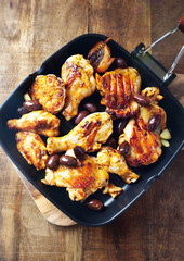 Grilled chicken pieces with kalamata olives. Top view. 