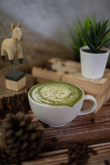 Fresh milk green tea menu is placed on a wooden table. The background is a polished wall. beautifully arranged Suitable for making menus - 443234366
