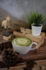 Fresh milk green tea menu is placed on a wooden table. The background is a polished wall. beautifully arranged Suitable for making menus - 443234398