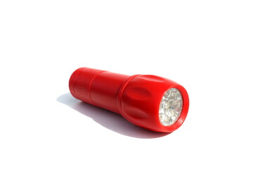 Red flashlight lies on a white background