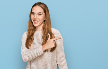 Obraz premium Young blonde woman wearing casual clothes cheerful with a smile of face pointing with hand and finger up to the side with happy and natural expression on face