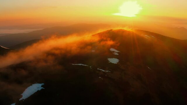 Aerial Drone View of Flight over Summer mountains at Sunset. Flying above Summits. Beautiful cinematic landscape. Dream concept 