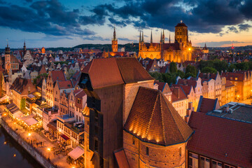 Amazing architecture of the main city in Gdansk at dusk, Poland. Aerial view of the historical Port...