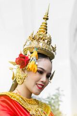 Beautiful Thai girl in traditional dress red dancer costume, identity culture of Thailand. Close up...