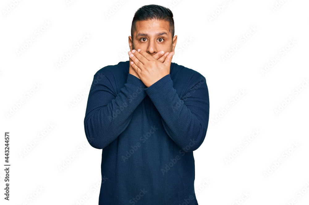 Canvas Prints Young latin man wearing casual clothes shocked covering mouth with hands for mistake. secret concept.