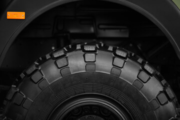 wheel of military off-road truck in closeup