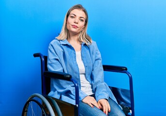 Beautiful caucasian woman sitting on wheelchair depressed and worry for distress, crying angry and afraid. sad expression.