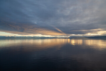 Fototapeta premium Sunset on mountains and sea in South East Alaska