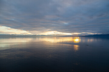 Fototapeta na wymiar Sunset on mountains and sea in South East Alaska