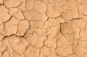 Dry lake in the process of drought and lack of rain or moisture. Global natural disaster. The cracked soil of the earth due to climate change. Hydrological drought, ecological catastrophy